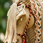 Detailed view of a handmade macramé horse sculpture with intricate knotted patterns.